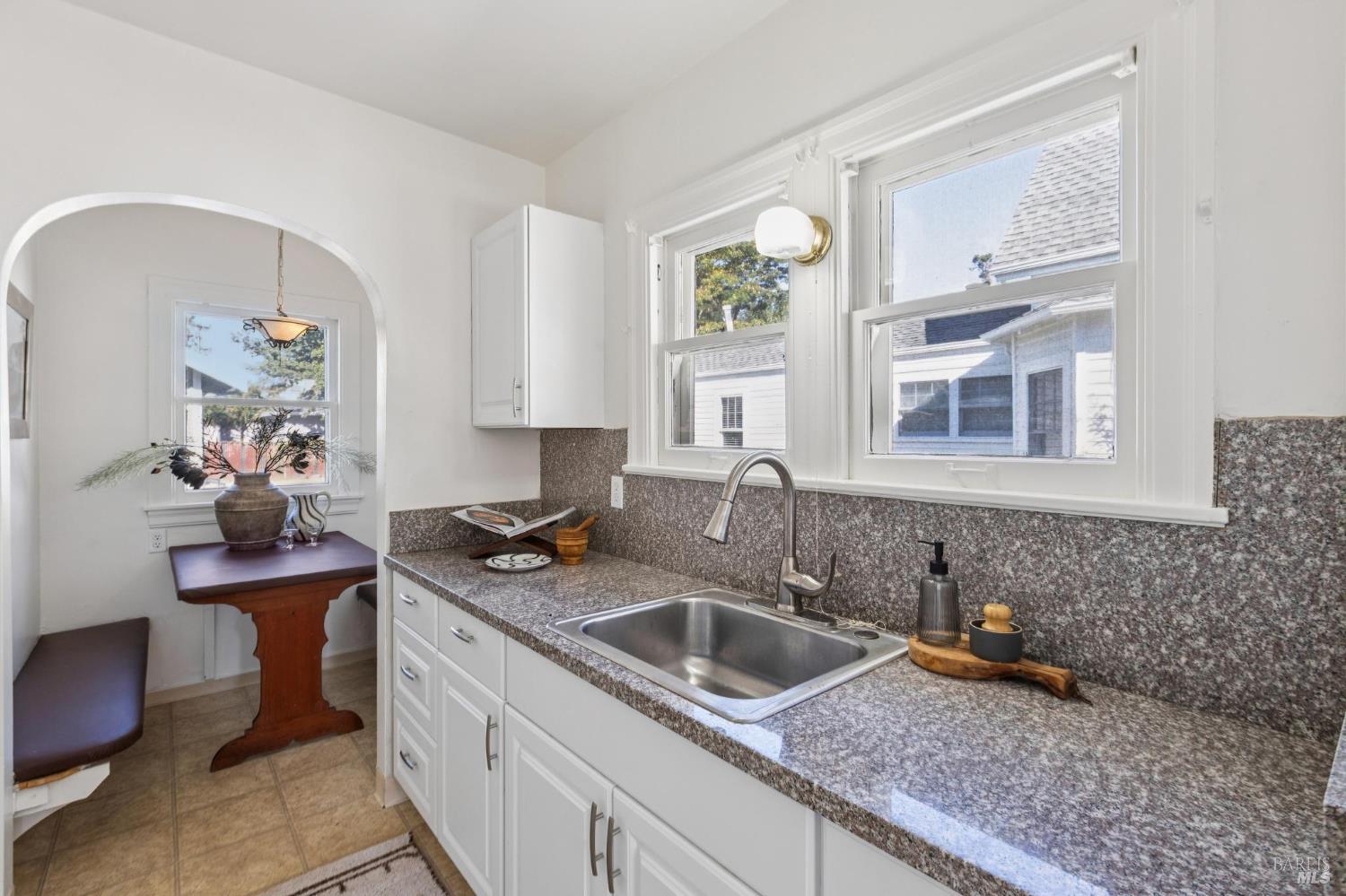 539 Randolph Street Napa, CA 94559 - Photo 16 of 35 a kitchen with stainless steel appliances granite countertop a sink stove and cabinets