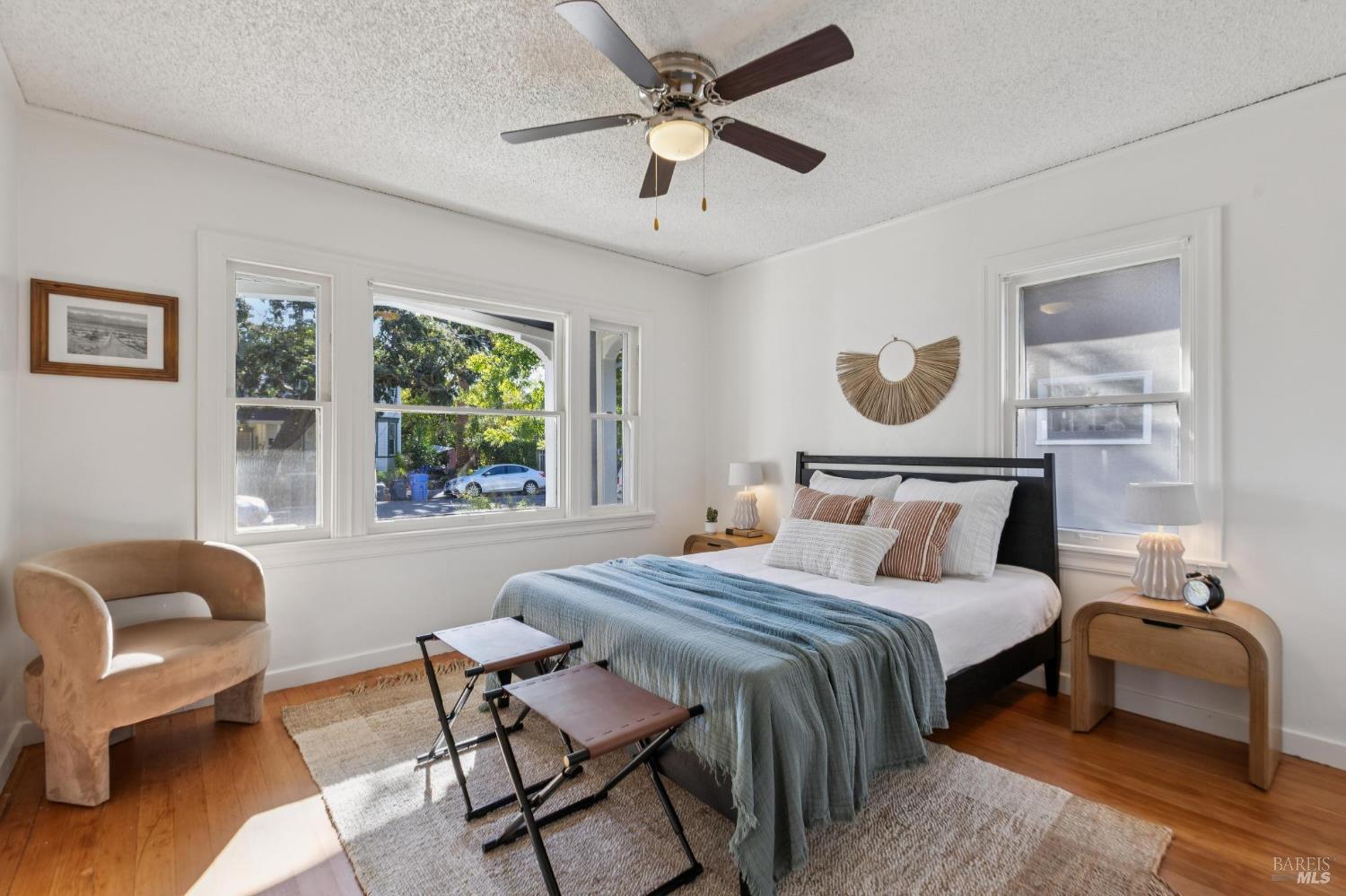 539 Randolph Street Napa, CA 94559 - Photo 21 of 35 a bedroom with a bed and a chandelier