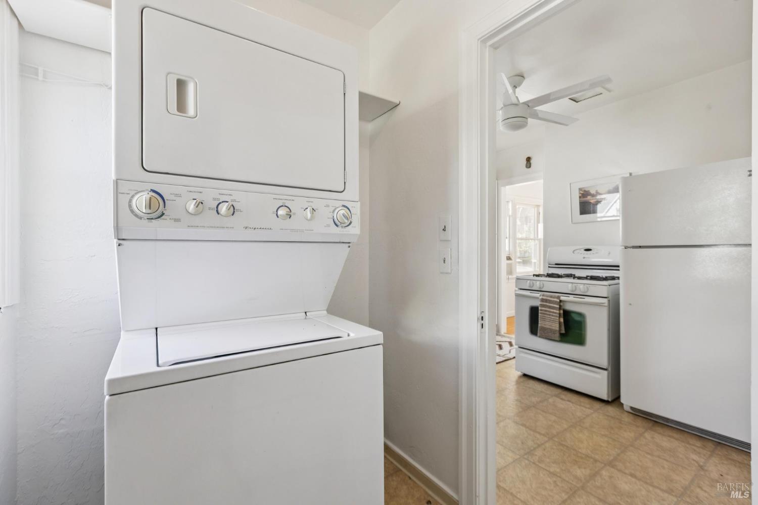 539 Randolph Street Napa, CA 94559 - Photo 30 of 35 a view of washer and dryer with kitchen in the background