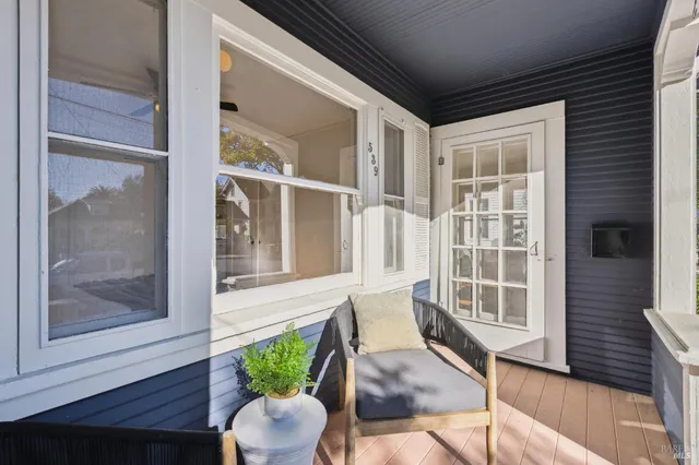 a view of a porch with furniture