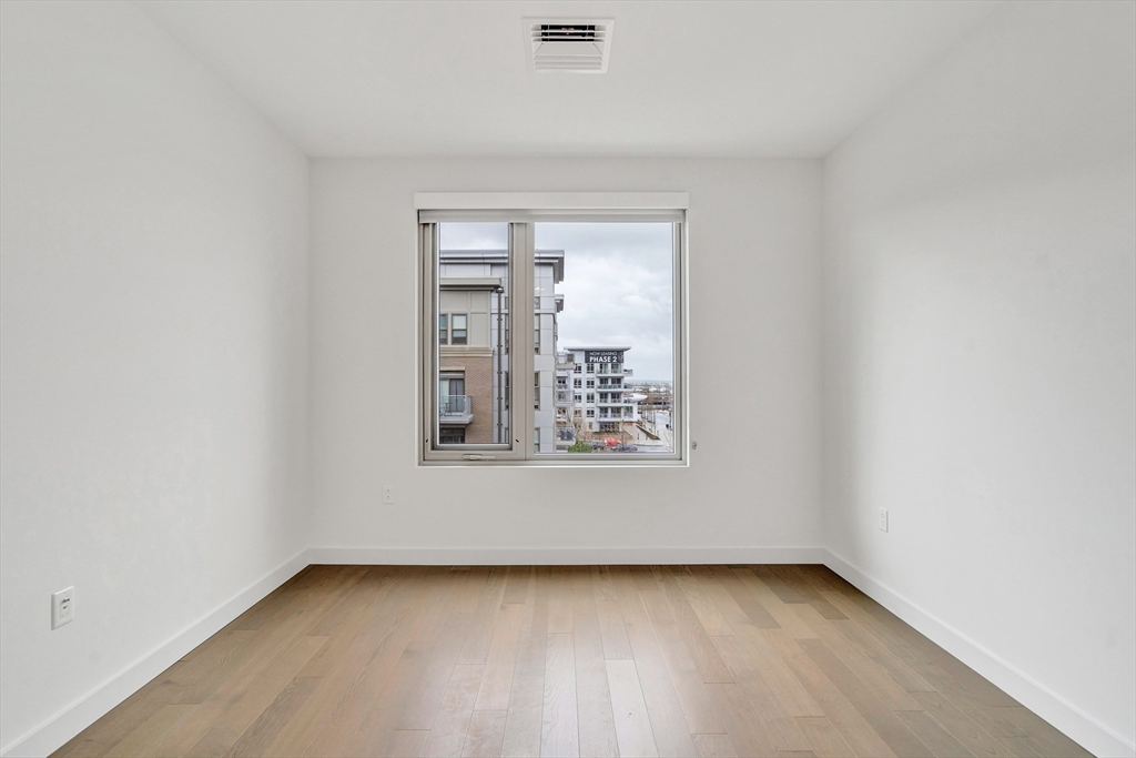 45 Lewis Street, Unit 406 Boston, MA 02128 - Photo 14 of 26 a view of a small space with wooden floor and a window