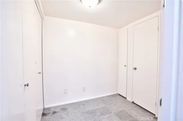 a view of cabinets and refrigerator