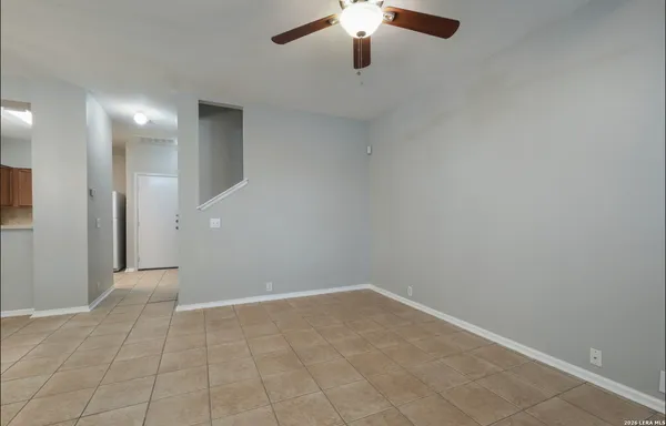 wooden floor in an empty room with a bathroom