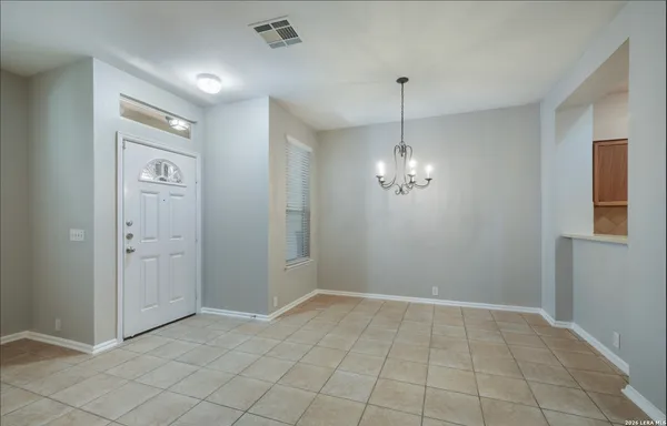 a view of a chandelier in big room and chandelier