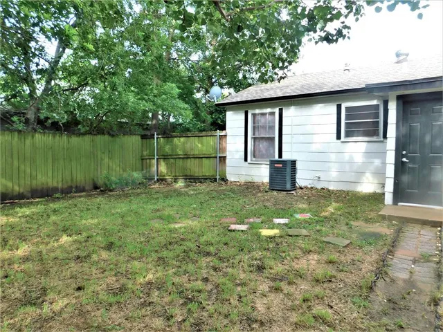 a backyard of a house with lots of green space