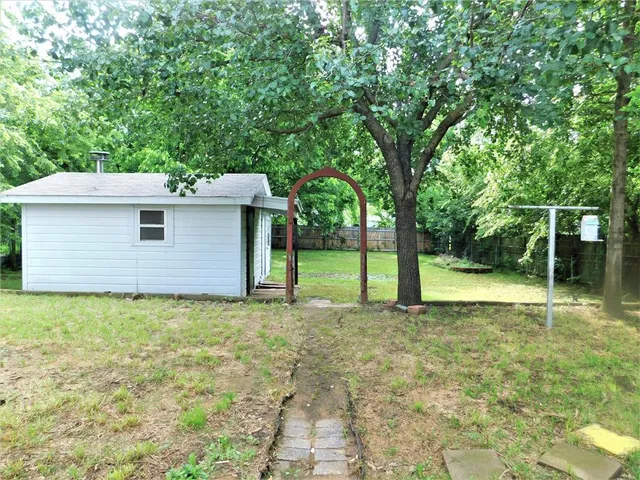 a backyard of a house with lots of green space