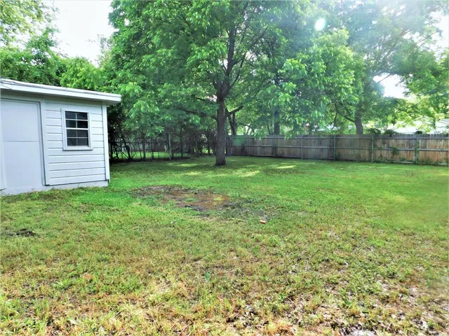 a view of a backyard with a garden