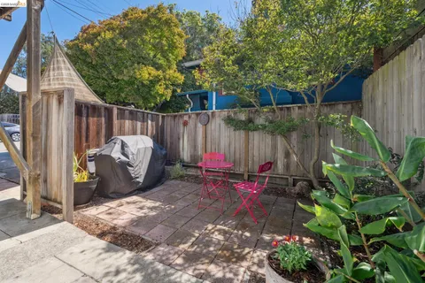 a view of a backyard with a patio and outdoor seating