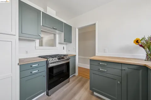 a kitchen with a stove and cabinets
