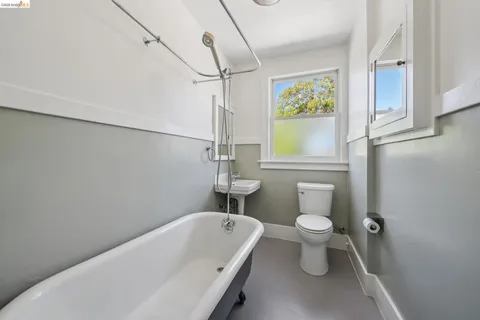 a bathroom with a toilet and a bathtub