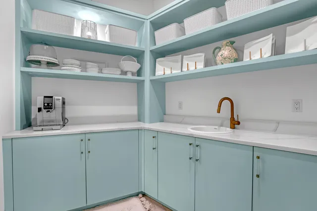 a view of a patio with table and chairs and potted plants