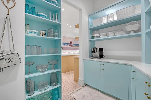 an aerial view of a house with a garden and swimming pool