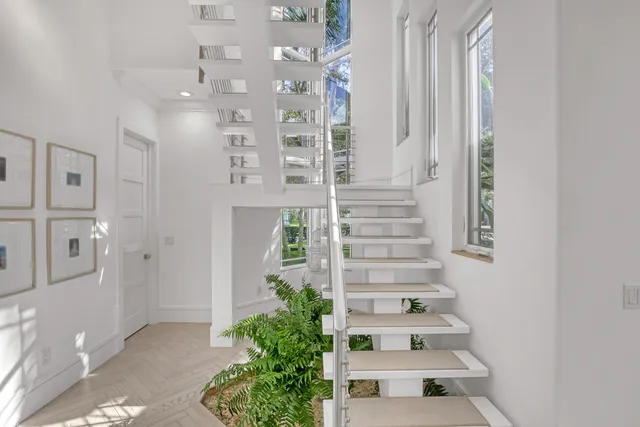 a living room with furniture or couch and a large window