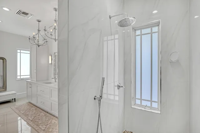 an aerial view of a house with a yard and garden