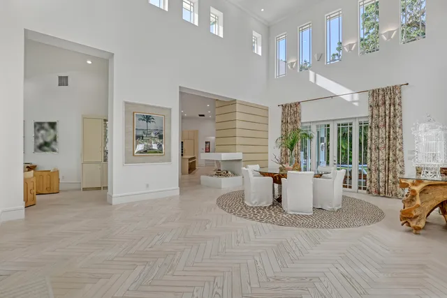 a dining room with furniture and chandelier