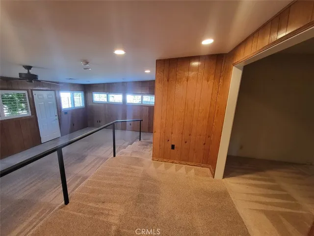 a view of an empty room with windows