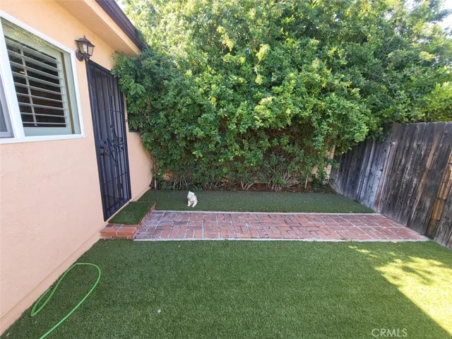 a view of a backyard with a small cabin