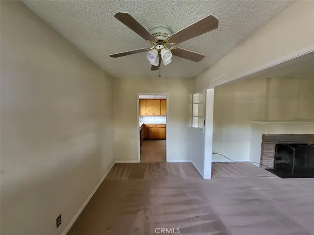 a view of an empty room and fire place