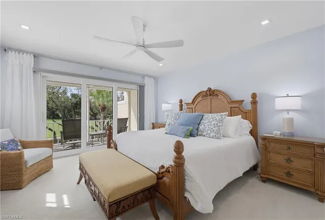 a bedroom with a bed couch and window