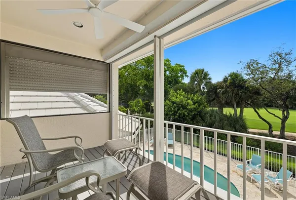 a view of a patio with a table chairs and a table