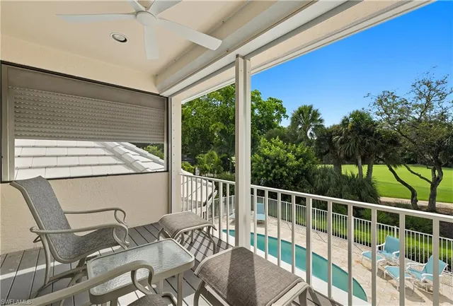a view of a patio with a table chairs and a table