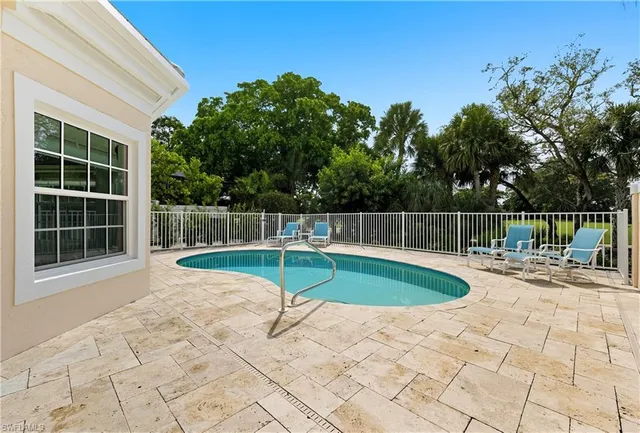 a view of a backyard with a small pool