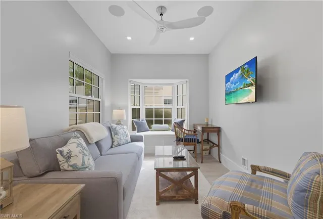 a living room with furniture and a window