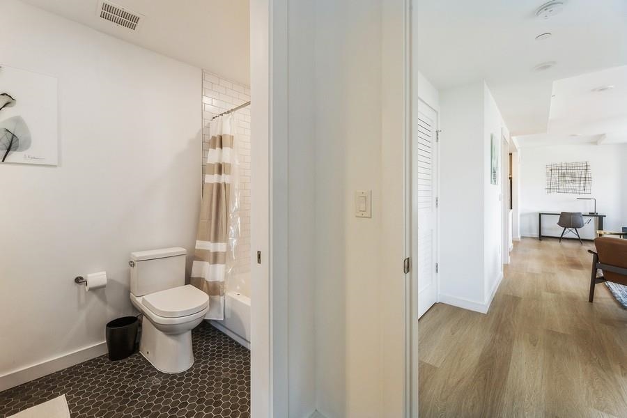 401 Jackson Street, Unit 507 Hoboken, NJ 07030 - Photo 25 of 29 a bathroom with a toilet and a shower