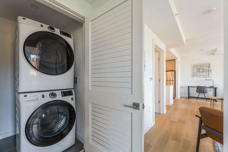 401 Jackson Street, Unit 507 Hoboken, NJ 07030 - Photo 29 of 29 a view of a hallway with washer and dryer