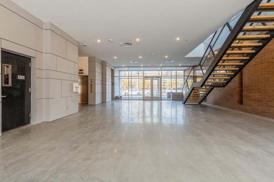 401 Jackson Street, Unit 507 Hoboken, NJ 07030 - Photo 5 of 29 a view of an empty room with stairs