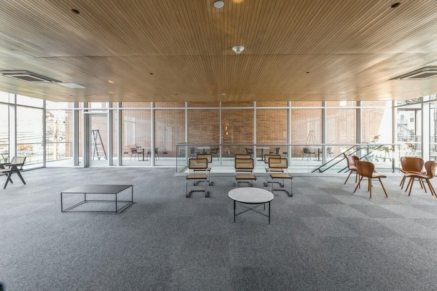 401 Jackson Street, Unit 507 Hoboken, NJ 07030 - Photo 8 of 29 a room with lots of tables and chairs