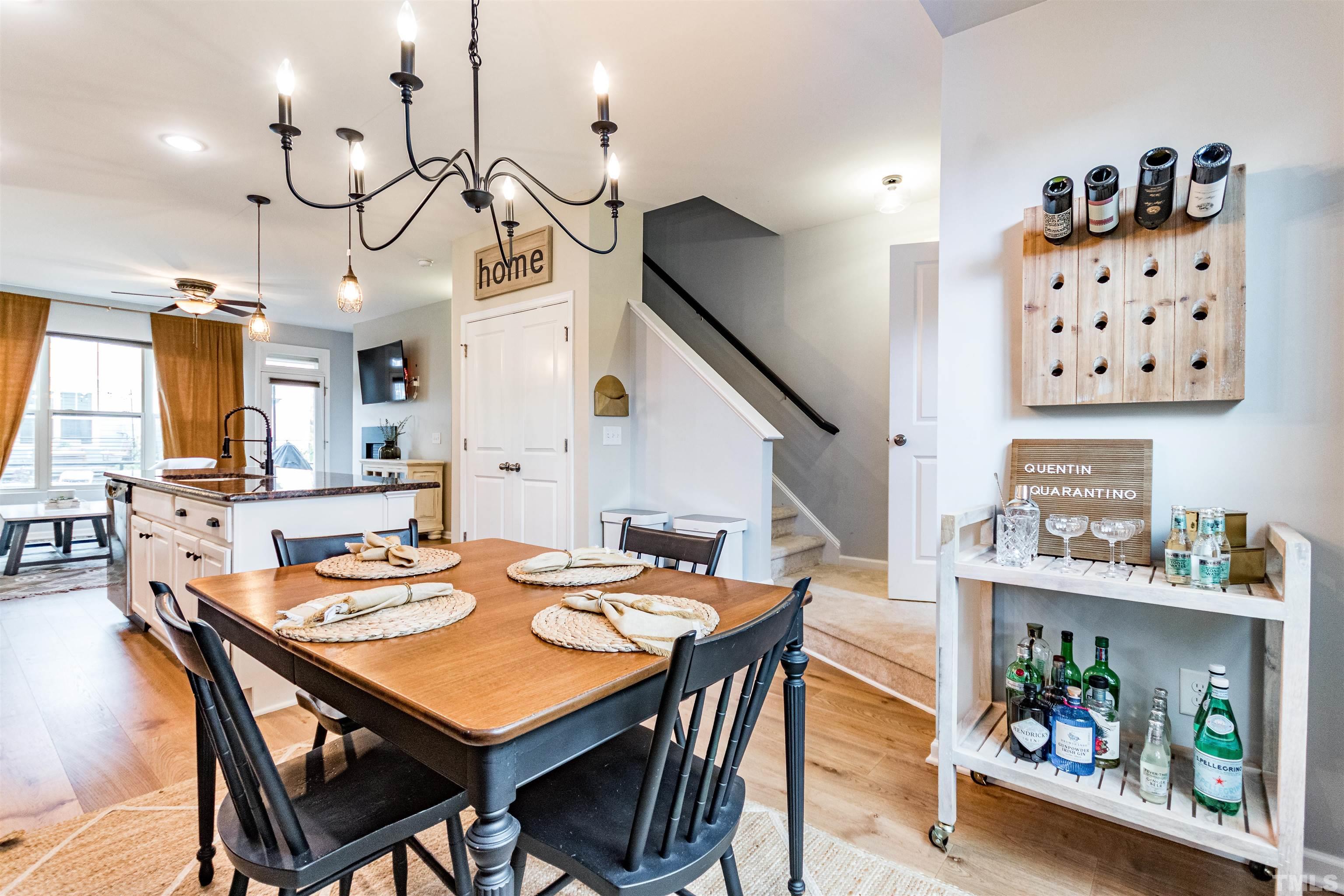 1417 Crafton Way Raleigh, NC 27607 - Photo 11 of 29 a dinning table and chairs in a kitchen