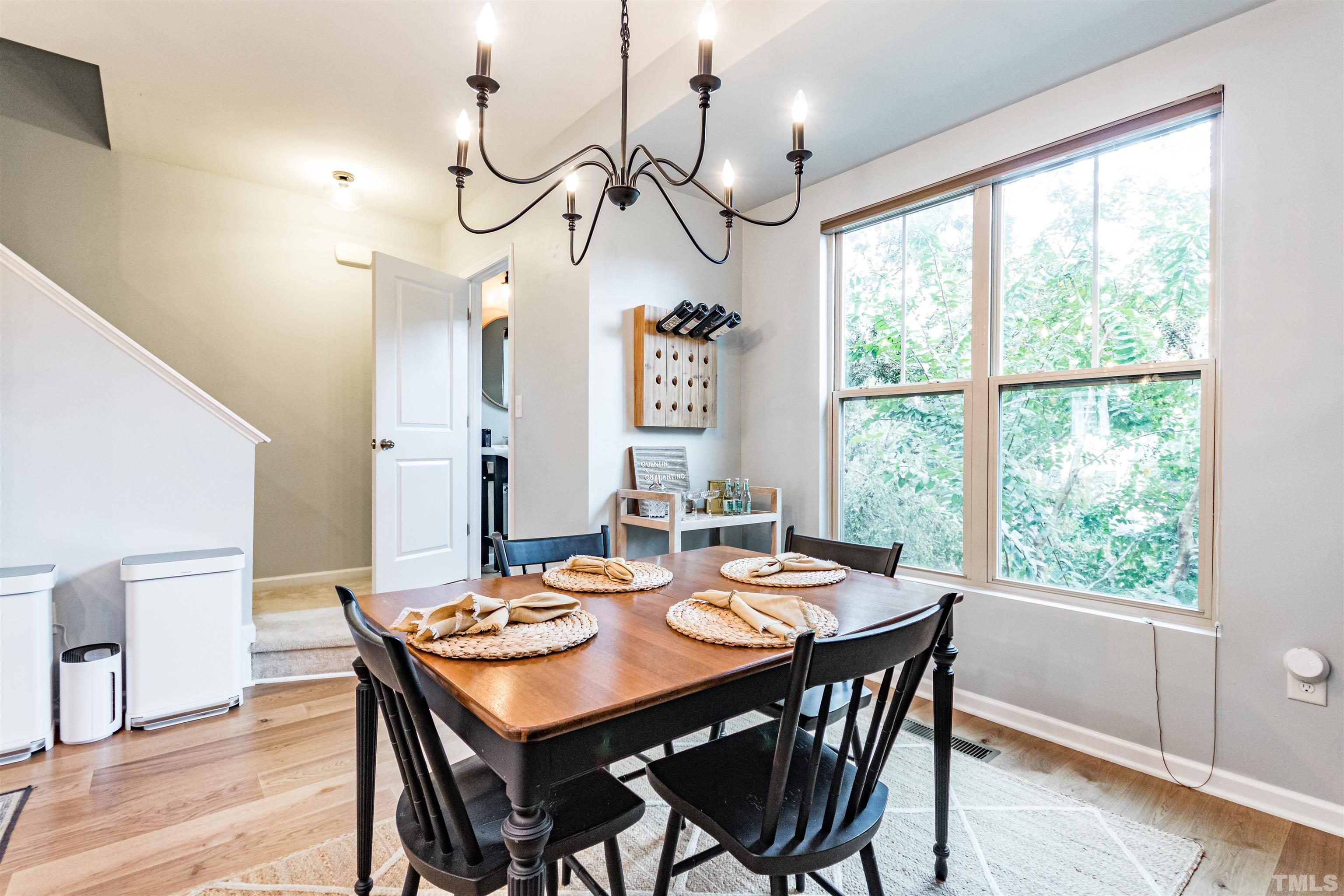 1417 Crafton Way Raleigh, NC 27607 - Photo 13 of 29 a view of a dining room with furniture window and wooden floor