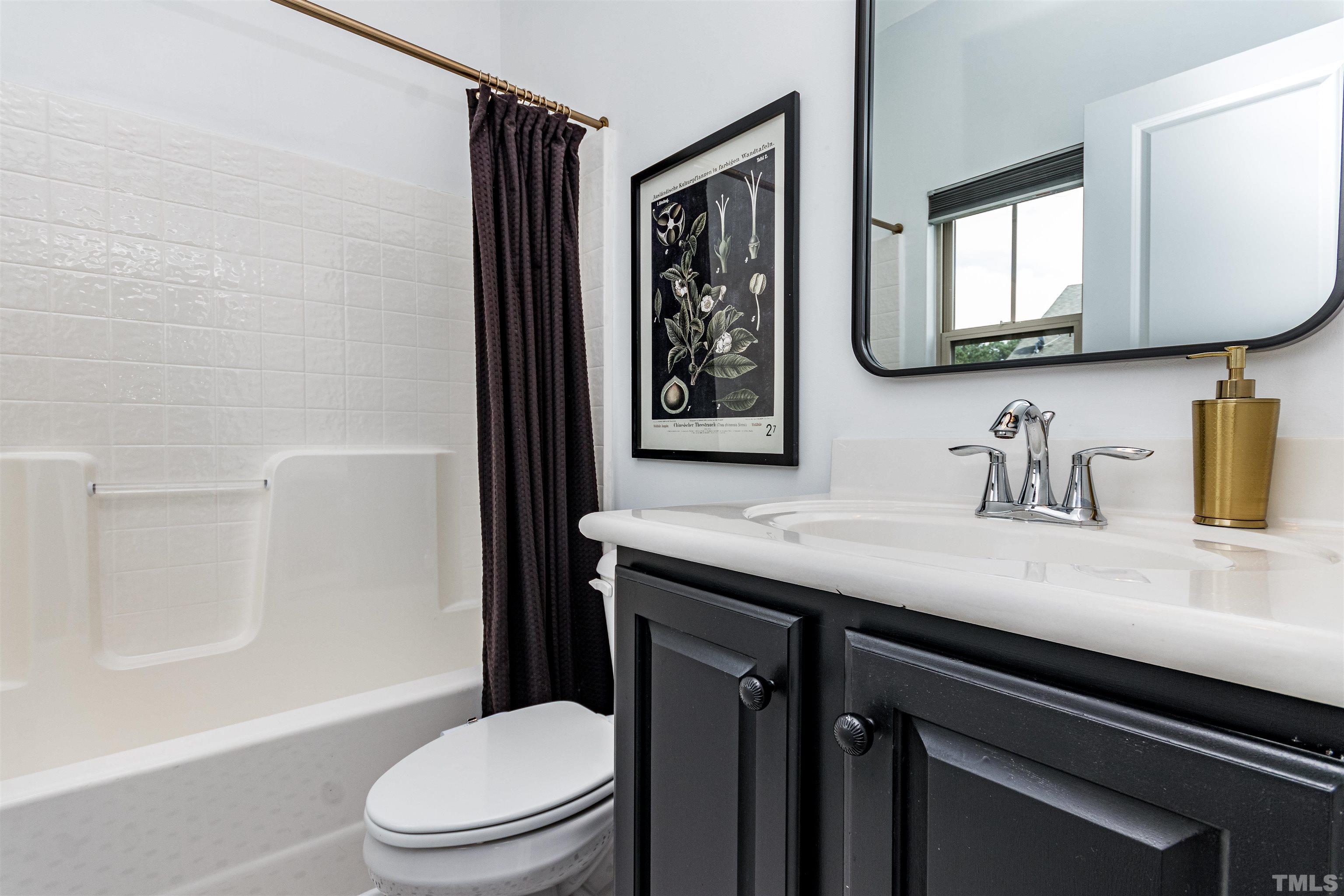1417 Crafton Way Raleigh, NC 27607 - Photo 25 of 29 a bathroom with a granite countertop sink toilet and shower