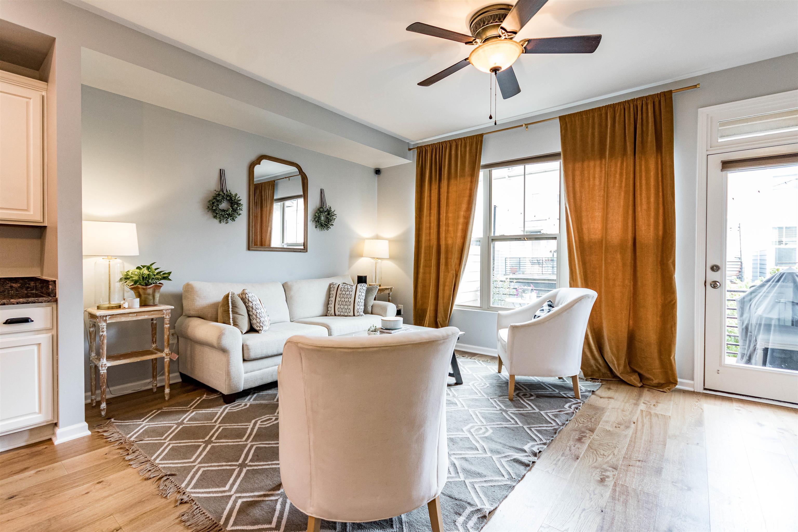 1417 Crafton Way Raleigh, NC 27607 - Photo 3 of 29 a living room with furniture a table and a large window