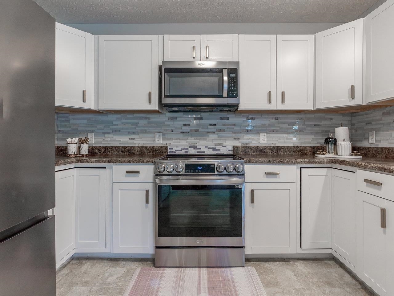 3192 Hebron Court Harrisonburg, VA 22801 - Photo 25 of 75 a kitchen with granite countertop white cabinets and stainless steel appliances