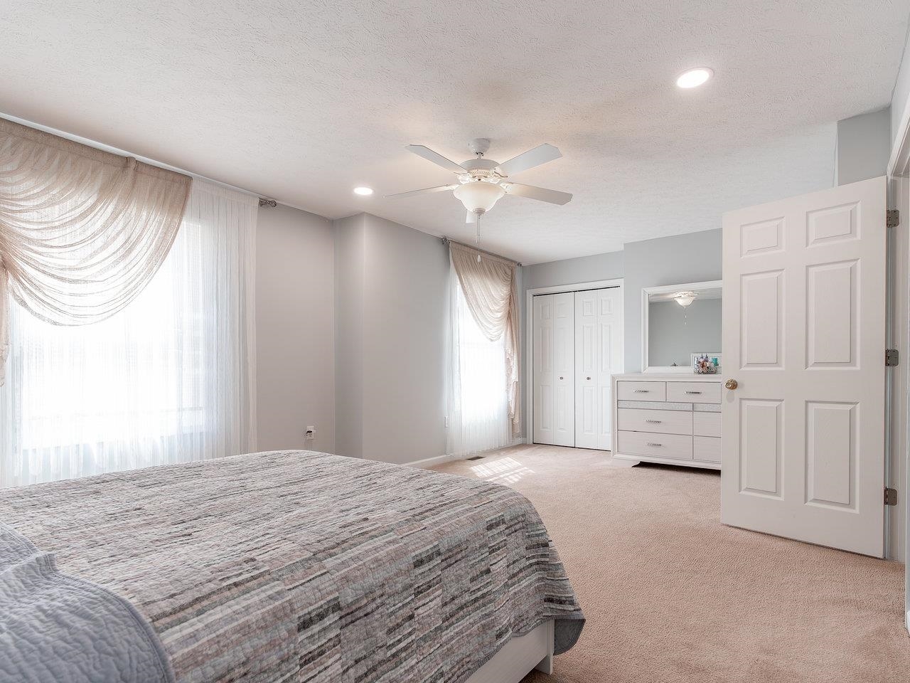 3192 Hebron Court Harrisonburg, VA 22801 - Photo 45 of 75 a bedroom with a bed and a chandelier