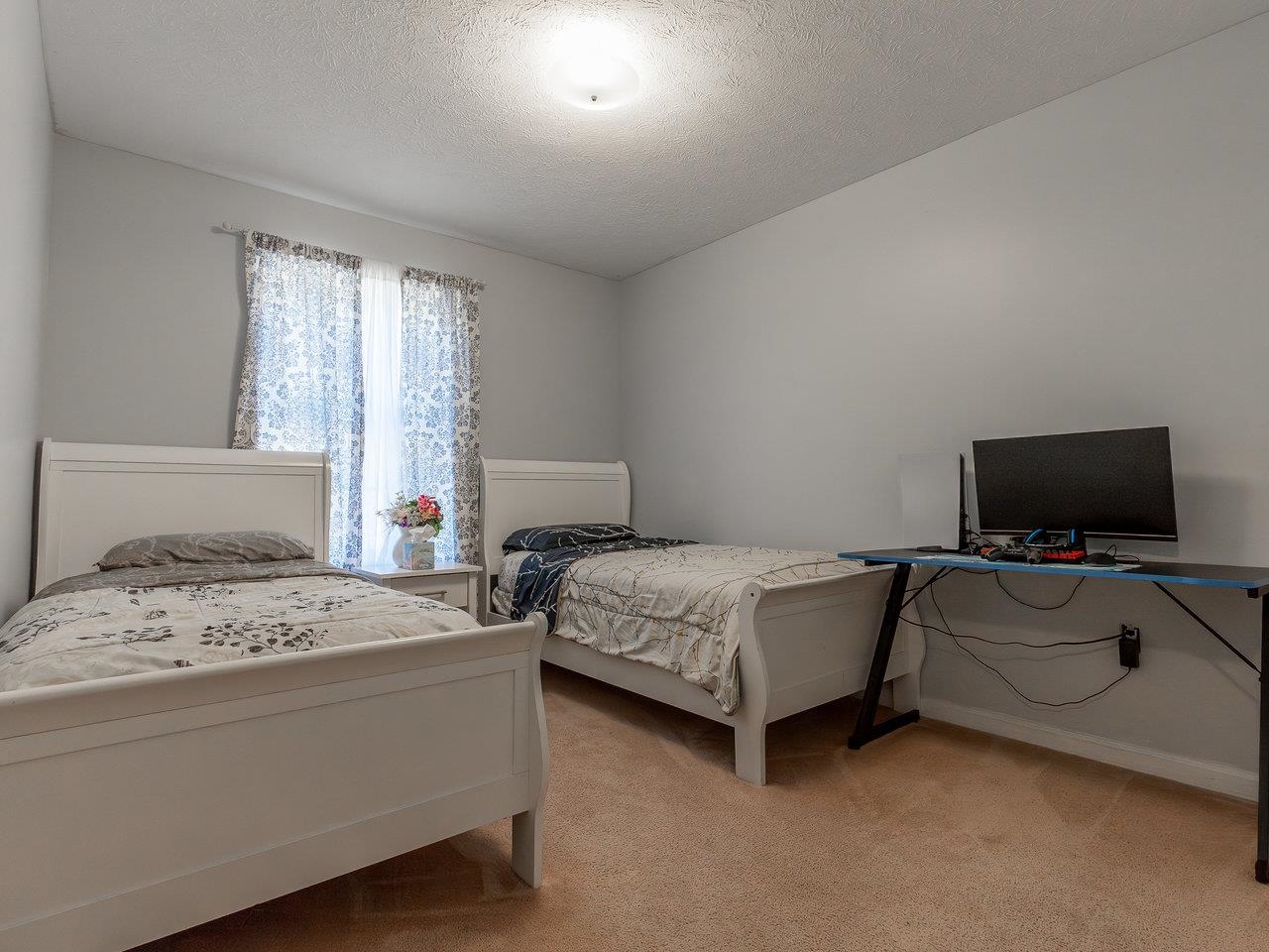 3192 Hebron Court Harrisonburg, VA 22801 - Photo 47 of 75 a bedroom with a bed and flat screen tv