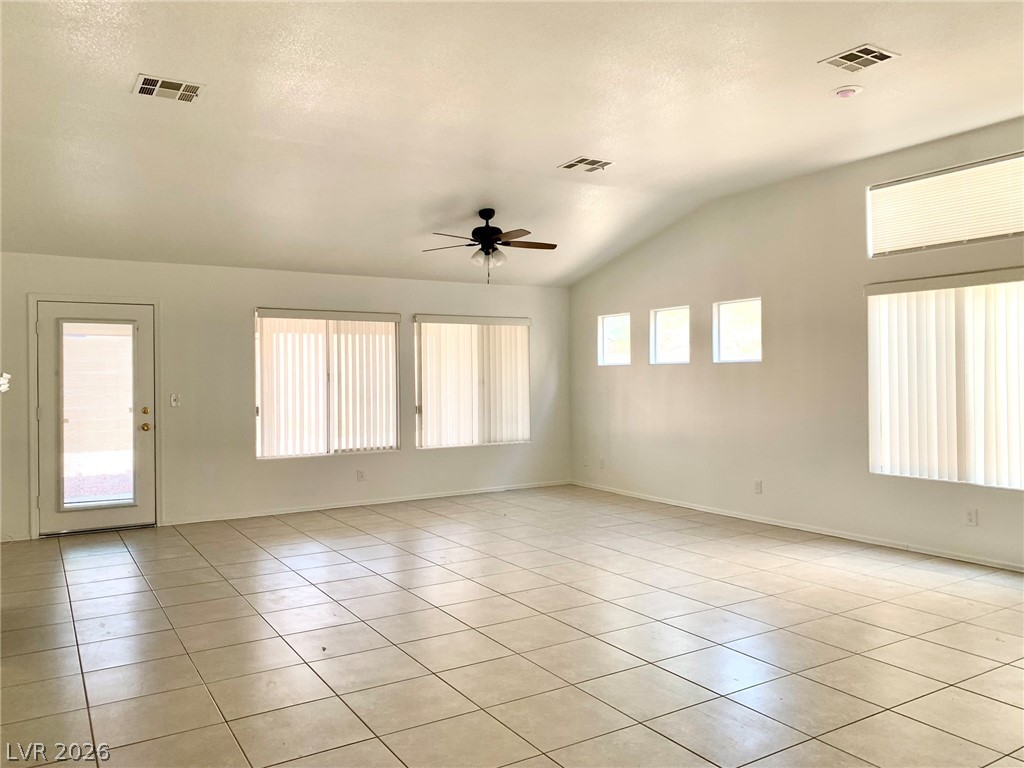 3821 Bombastic Court Las Vegas, NV 89147 - Photo 4 of 36 This expansive living space features high ceilings and ample natural light.