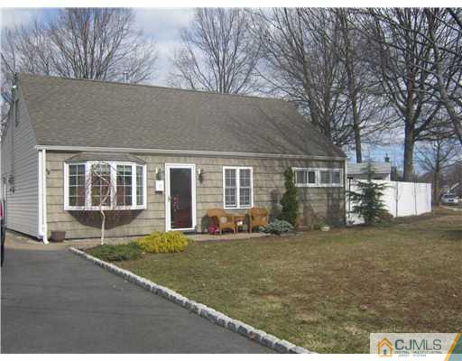 17 Markham Road Edison, NJ 08817 - Photo 6 of 13 a front view of a house with a yard