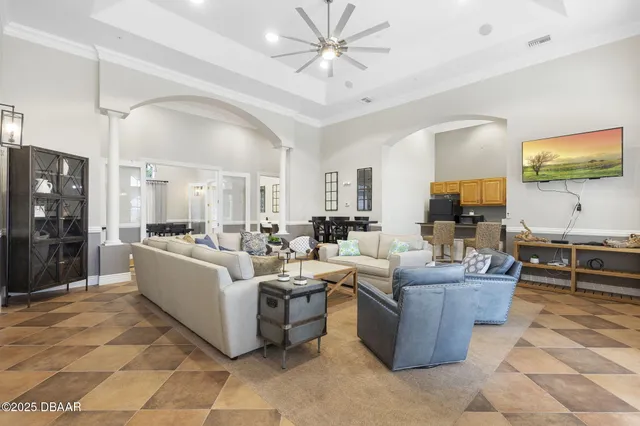 a kitchen with stainless steel appliances granite countertop a refrigerator a stove a sink dishwasher and a refrigerator with a dining table