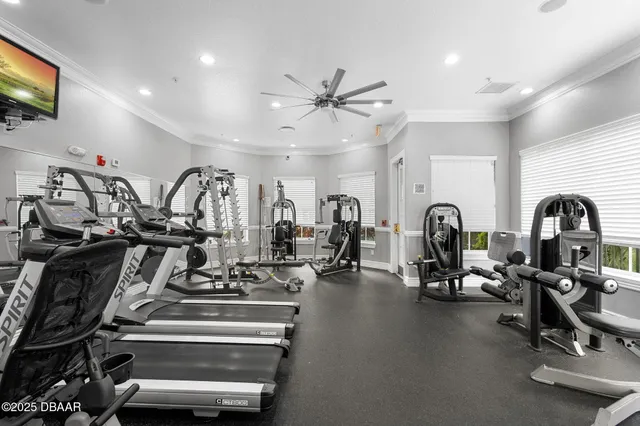 an aerial view of a house with a garden and lake view