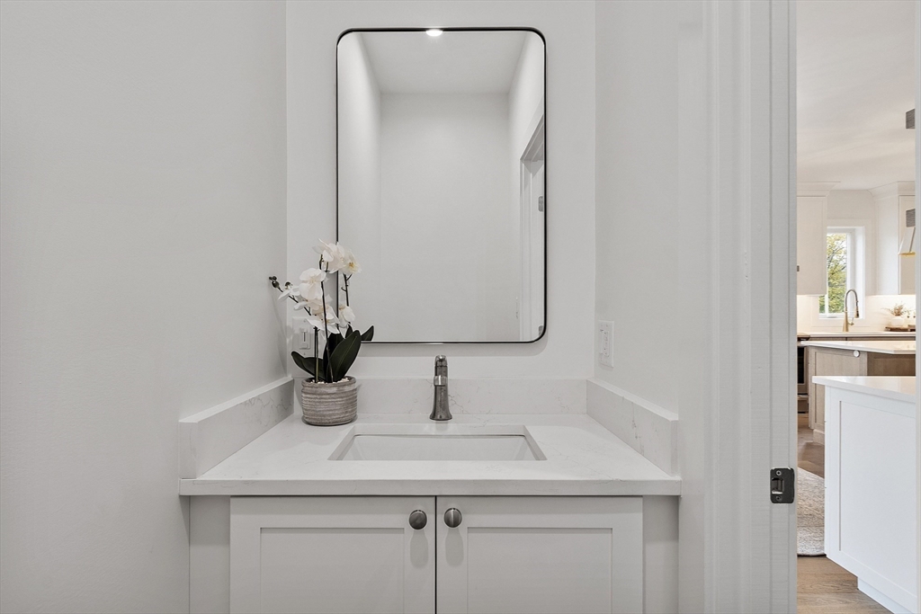 225 Middlesex Turnpike, Unit 106 Burlington, MA 01803 - Photo 11 of 23 a bathroom with a sink and a mirror