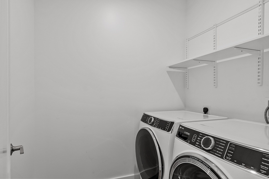 225 Middlesex Turnpike, Unit 106 Burlington, MA 01803 - Photo 12 of 23 a utility room with dryer and washer