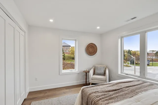 a bedroom with a large bed and a couch