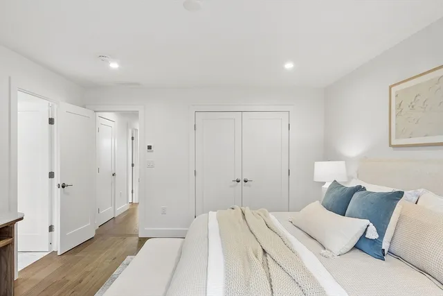 a bathroom with a double vanity sink mirror and toilet