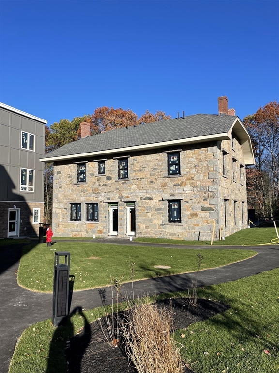 225 Middlesex Turnpike, Unit 106 Burlington, MA 01803 - Photo 2 of 23 a view of a house with backyard