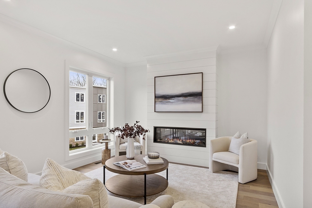 225 Middlesex Turnpike, Unit 106 Burlington, MA 01803 - Photo 8 of 23 a living room with furniture and a potted plant