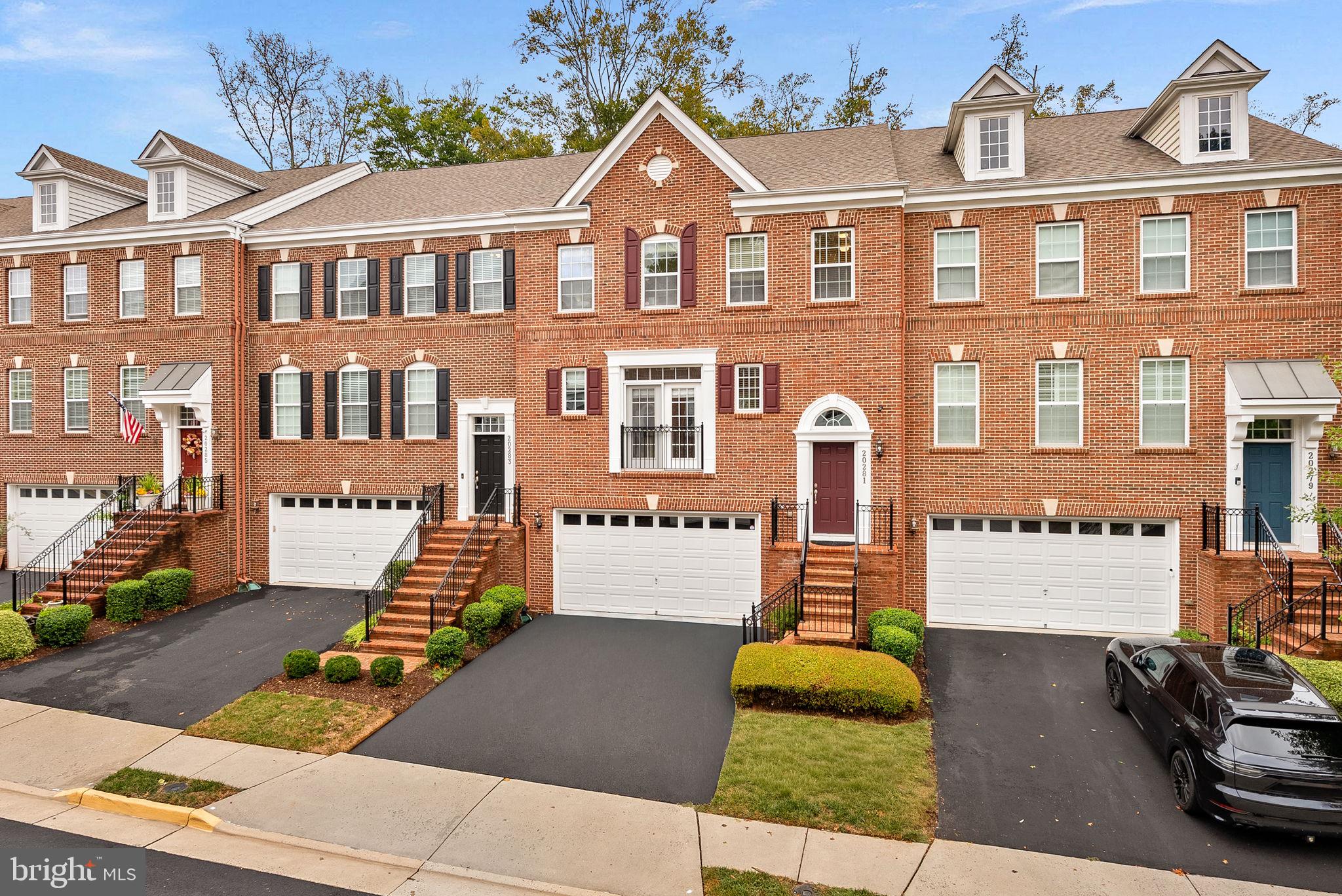 20281 Center Brook Square Sterling, VA 20165 - Photo 1 of 51 a front view of a house with garden