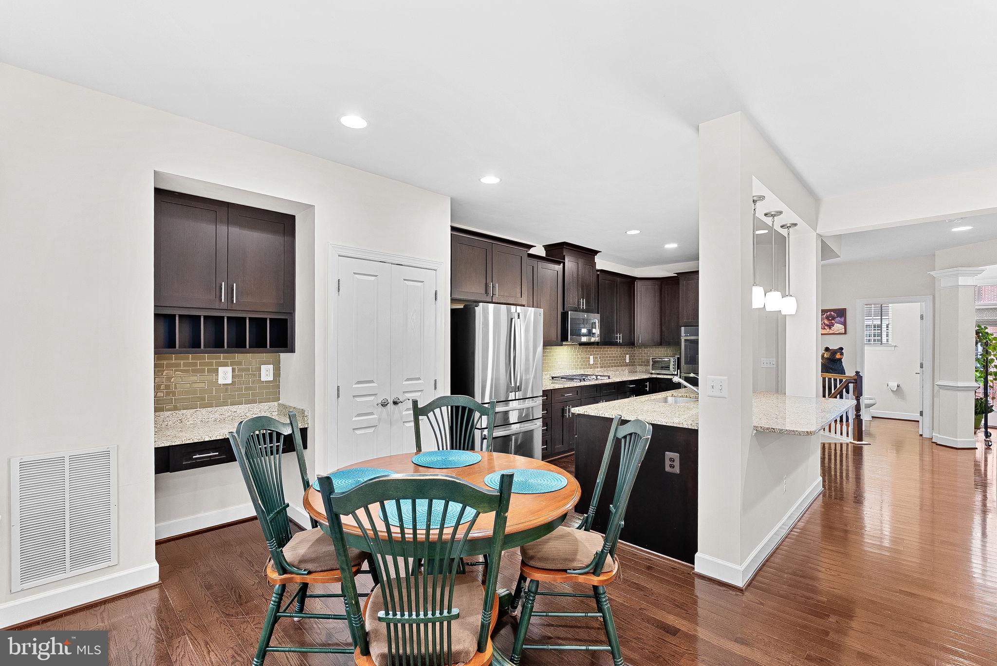 20281 Center Brook Square Sterling, VA 20165 - Photo 11 of 51 a view of a dining room with furniture and wooden floor